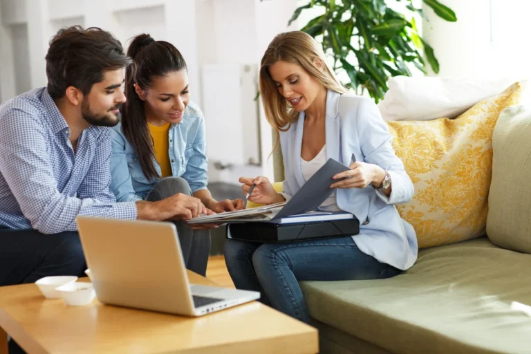 Couple talking with property manager