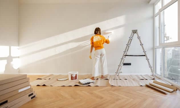 Woman Painting White Apartment